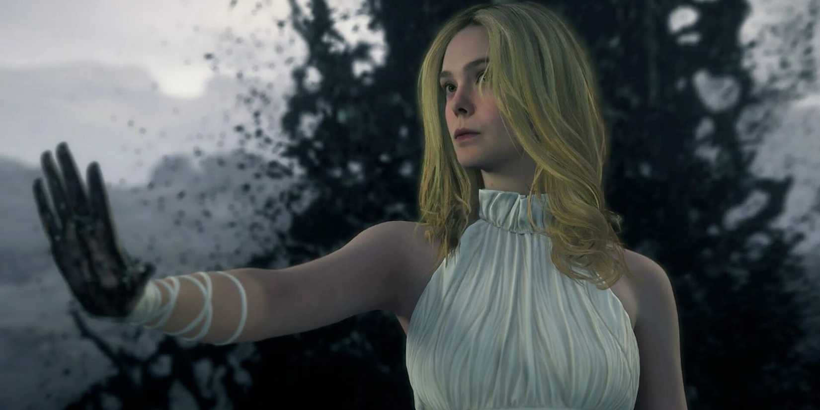Elle Fanning as Tomorrow lifting up her hand which is all black in 'Death Stranding 2: On the Beach'