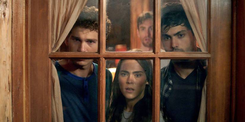 Four young people looking through a window in Cabin Fever 