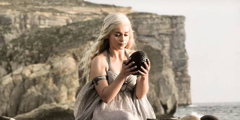 Daenerys holding one of her unhatched dragon eggs in Game of Thrones Season 1