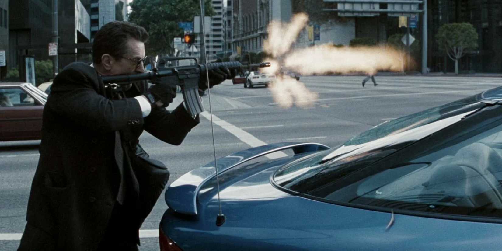 Robert De Niro firing a gun in Heat