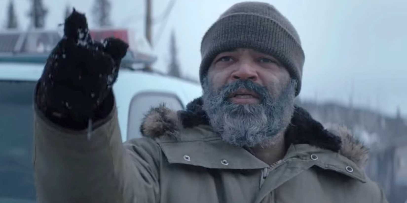 Russell Core (Jeffrey Wright) pointing towards the distance in Hold the Dark