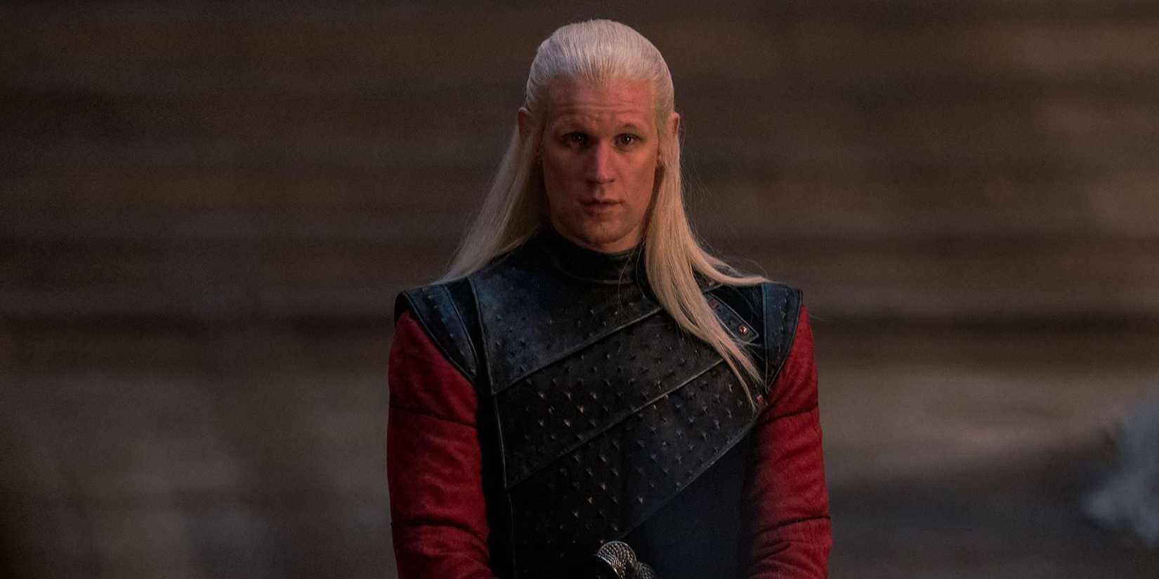 Daemon Targaryen stands in the throne room of the Red Keep