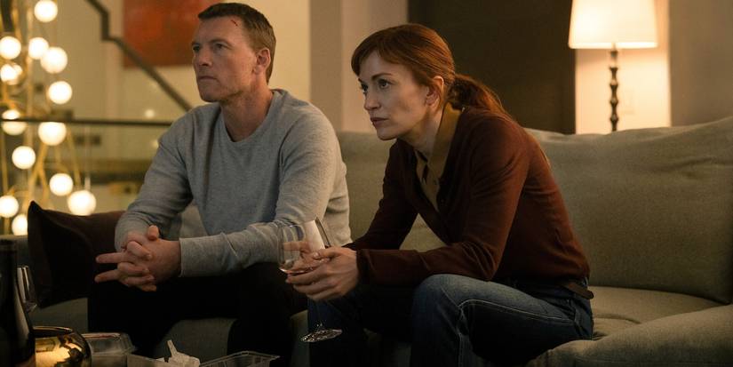 David and Rachel sitting on a sofa in 'I Will Find You'