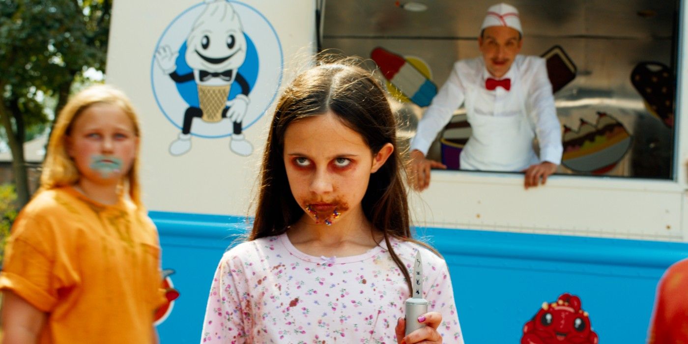 A killer kid stands in front of the Ice Cream Man in 'Ice Cream Man'
