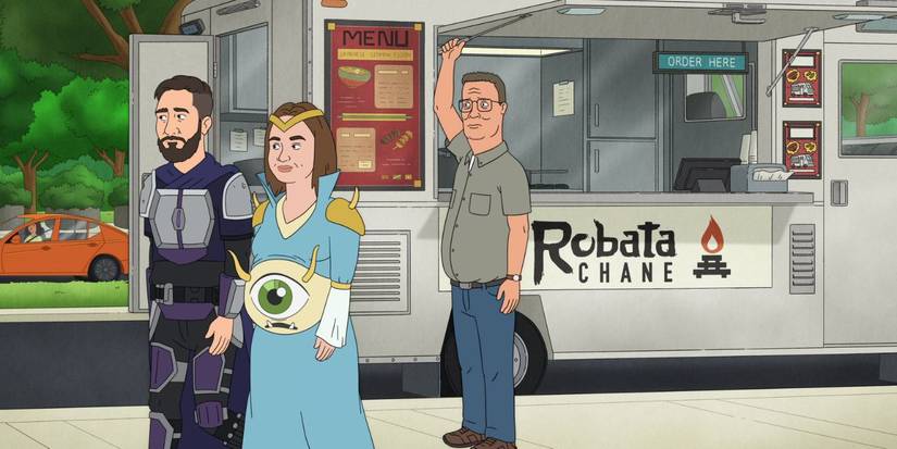 Hank Hill standing by a food truck and watching two cosplayers walk by in King of the Hill Season 15.