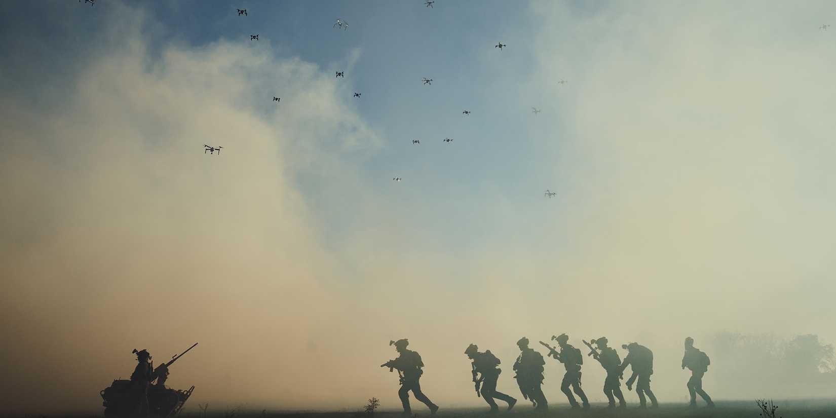 Soldiers running past drones in the sky in Lioness Season 3