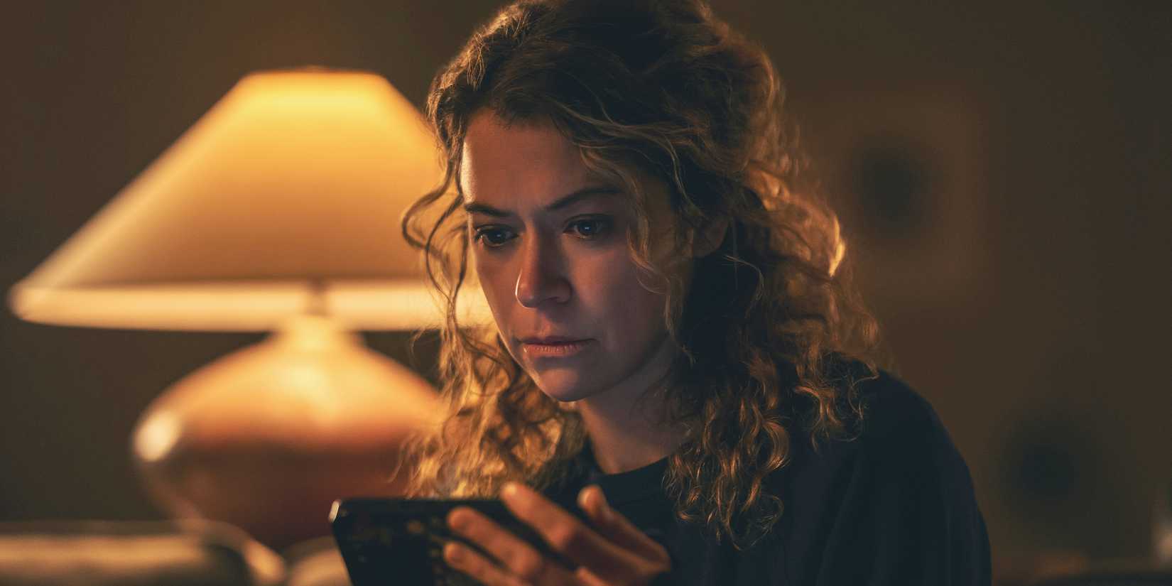 Tatiana Maslany staring at her phone in Maximum Pleasure Guaranteed