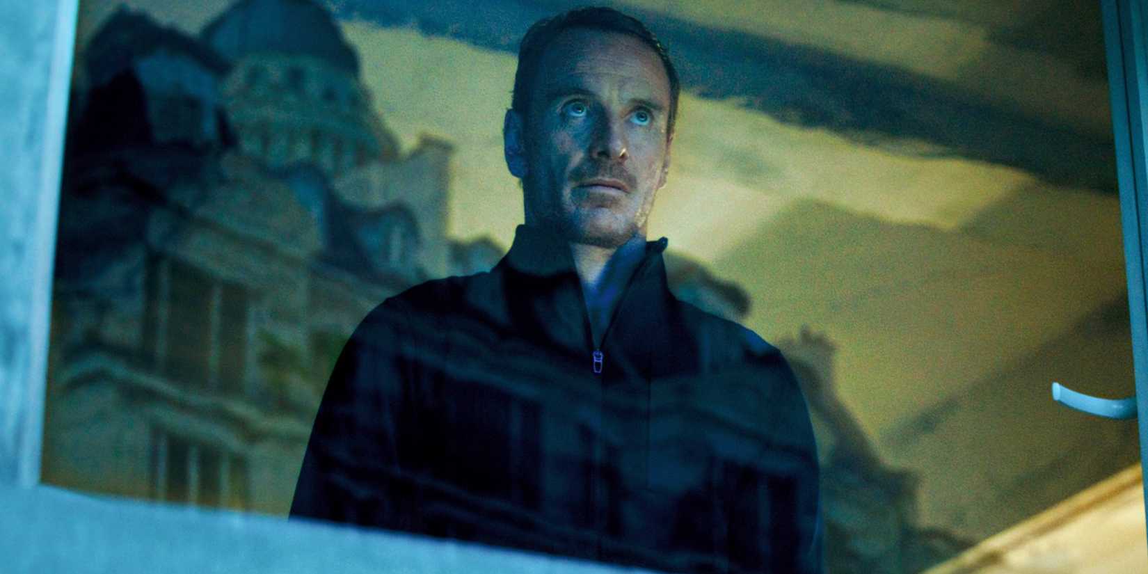 Michael Fassbender looking out the window in 'The Killer'