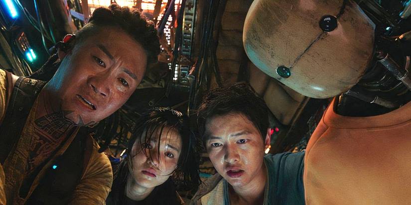 Tiger Park, Captain Jang, Tae-ho, and Bubs looking down at Dorothy in 'Space Sweepers'