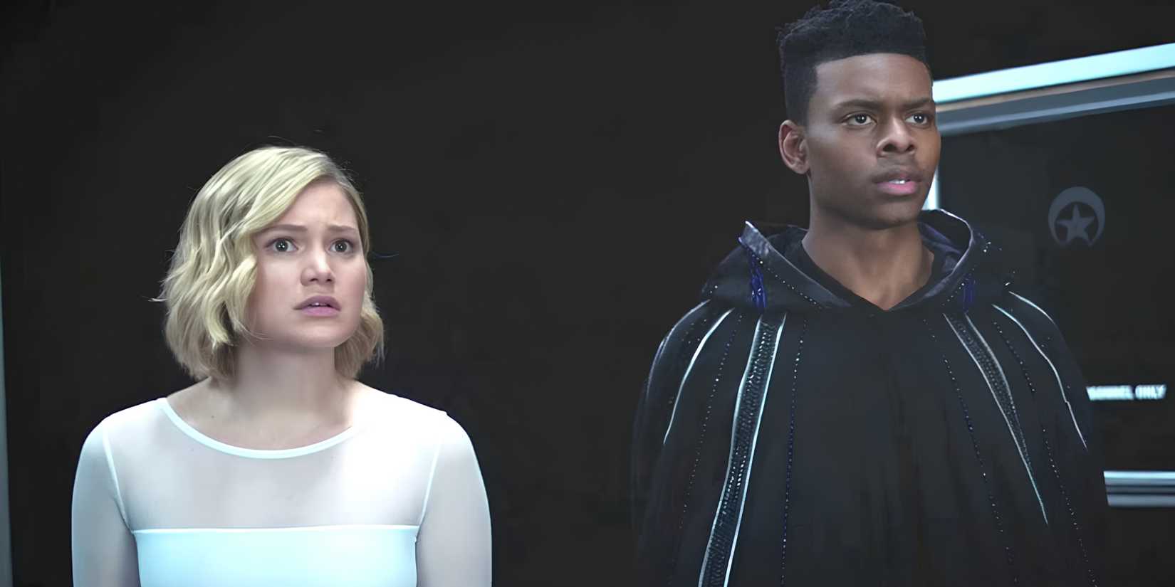 Tandy/Dagger (Olivia Holt) and Tyrone/Cloak (Aubrey Joseph) looking at something offscreen in Cloak & Dagger.