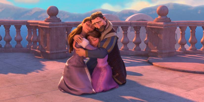 Rapunzel and her parents hugging at the end of 'Tangled'