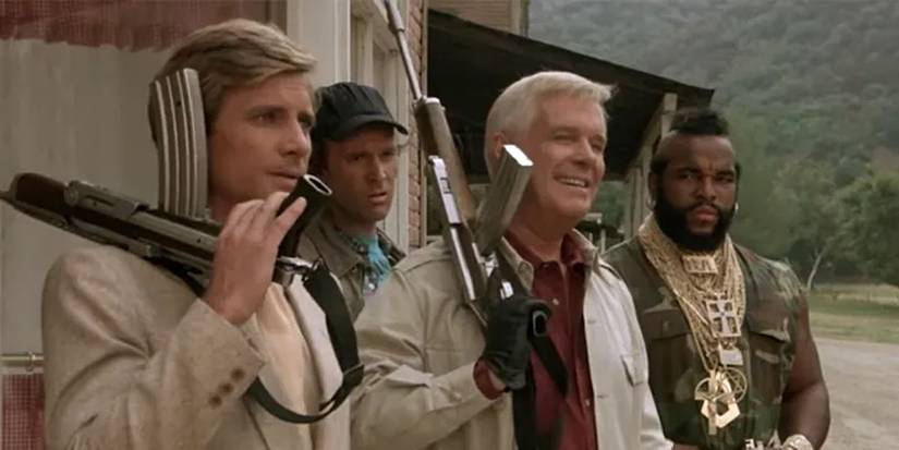 The cast of 'The A-Team' holding weapons.