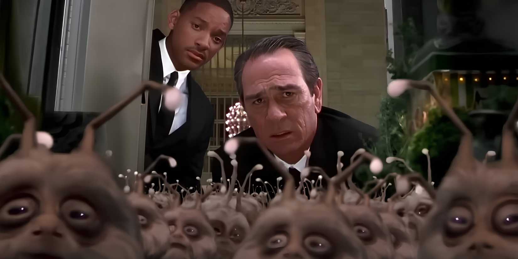 Agents K (Tommy Lee Jones) and J (Will Smith) open a locker door to find tiny aliens in Men in Black II.