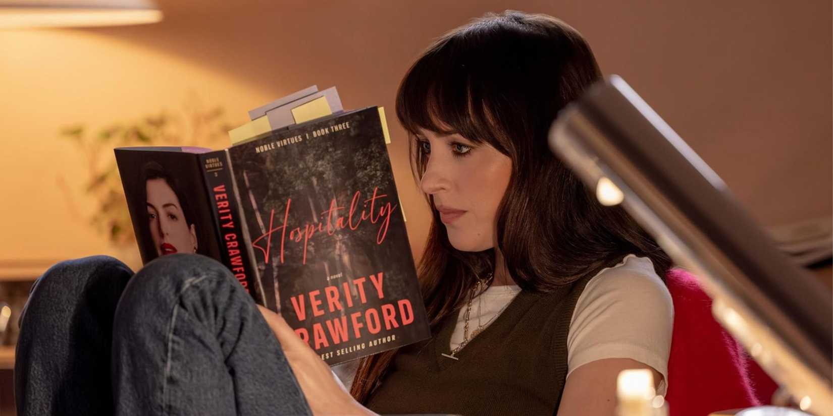 Dakota Johnson reading a book as Lowen in Verity. 