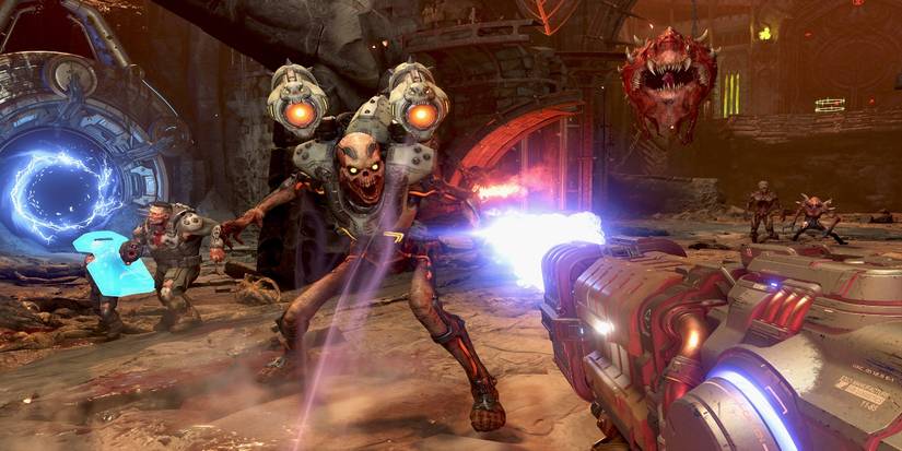 First-person view of the player shooting a monster in doom-eternal