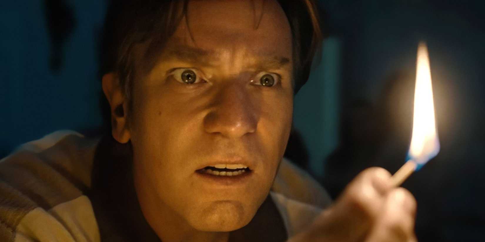 Ewan McGregor holding a lit match in The End of Oak Street.