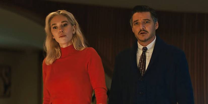 Reed and Sue looking down at something off-camera in The Fantastic Four: First Steps