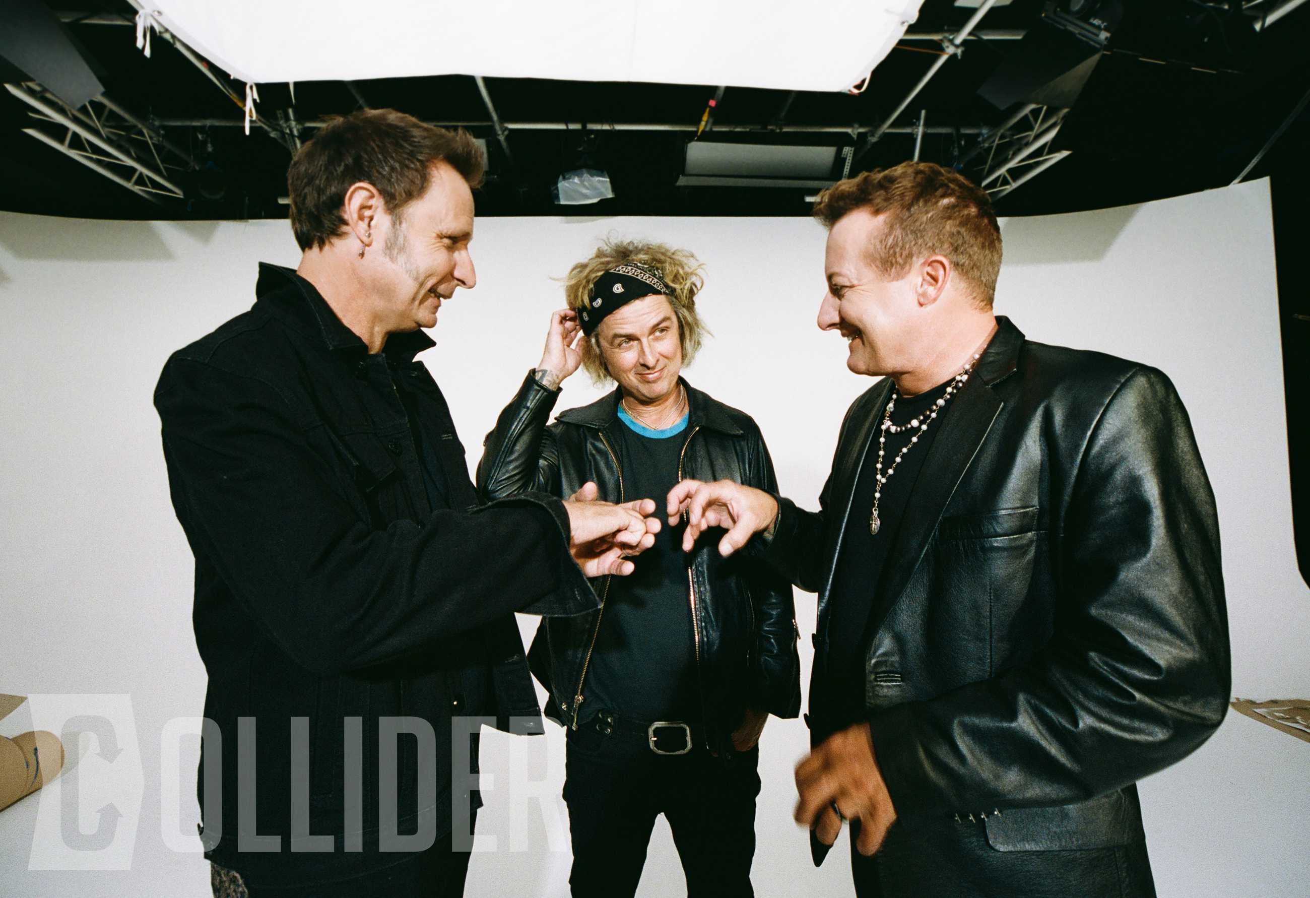 Green Day members Mike Dirnt, Billie Joe Armstrong and Tré Cool pose for an exclusive Collider portrait at BuzzFeed Studios in Los Angeles on July 14, 2026. (Photo by Sela Shiloni for Collider)