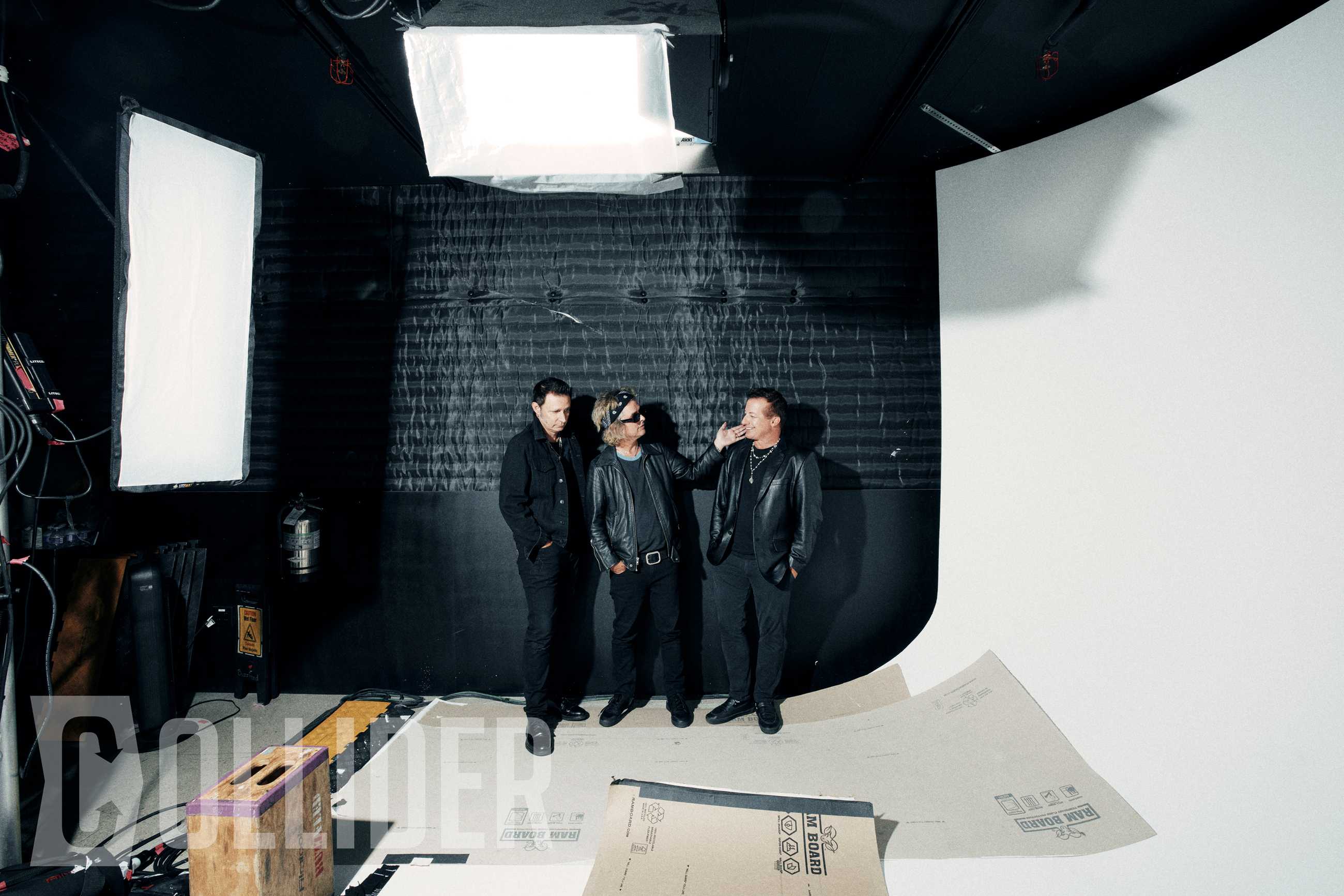 Green Day members Mike Dirnt, Billie Joe Armstrong and Tré Cool pose for an exclusive Collider portrait at BuzzFeed Studios in Los Angeles on July 14, 2026. (Photo by Sela Shiloni for Collider)