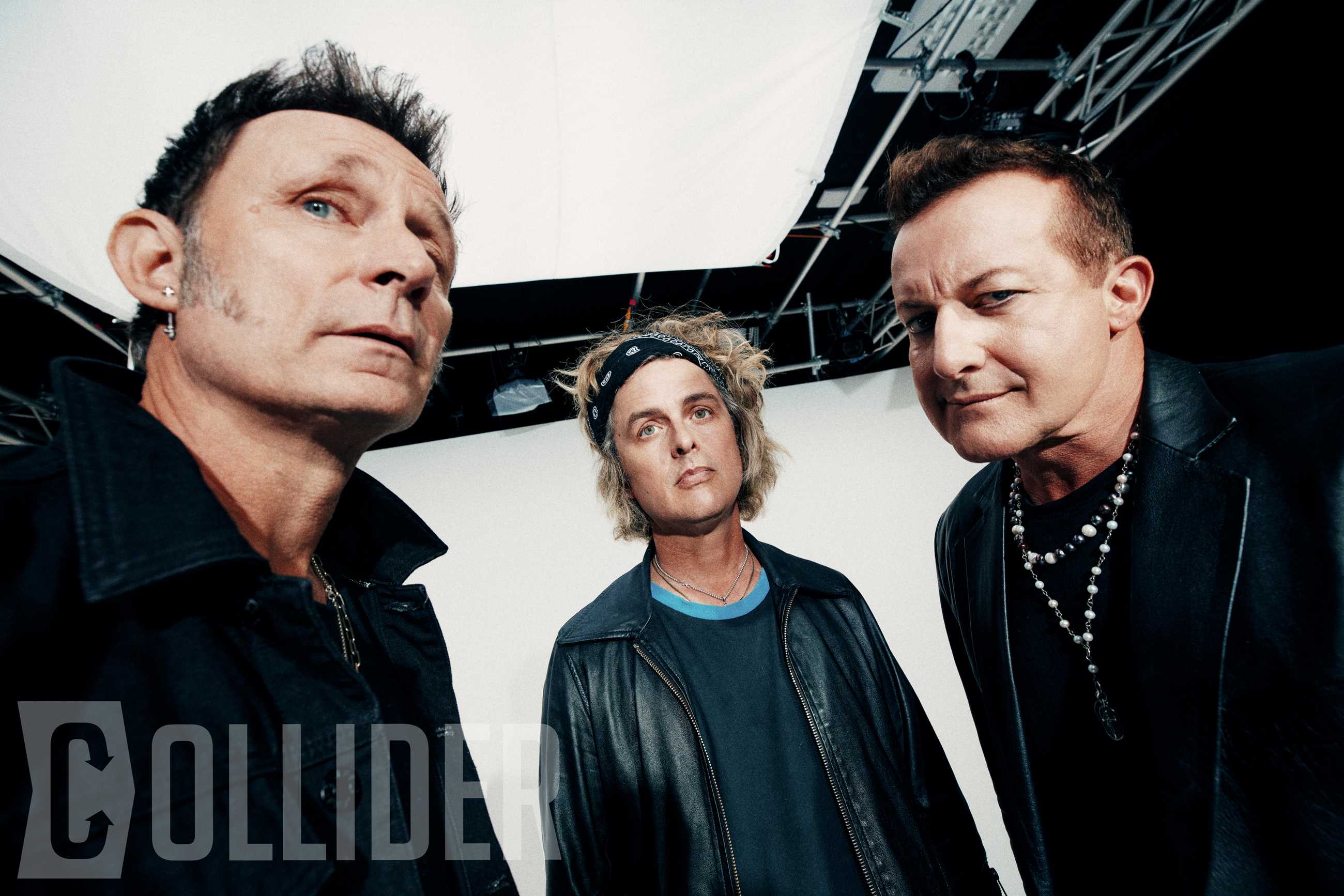 Green Day members Mike Dirnt, Billie Joe Armstrong and Tré Cool pose for an exclusive Collider portrait at BuzzFeed Studios in Los Angeles on July 14, 2026. (Photo by Sela Shiloni for Collider)