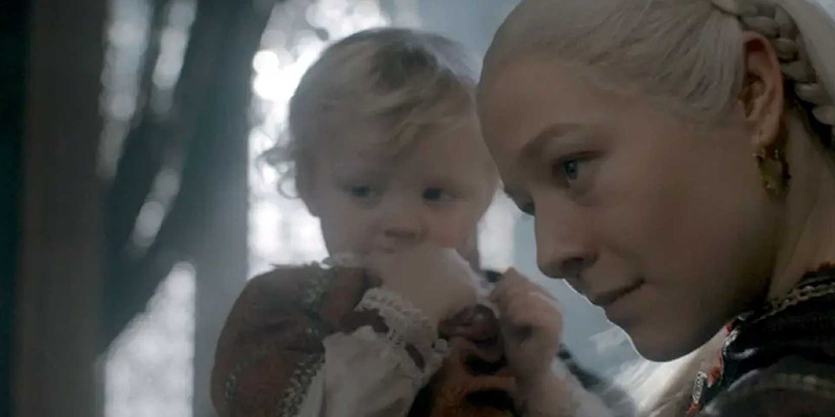 Viserys in Rhaenyra's arms