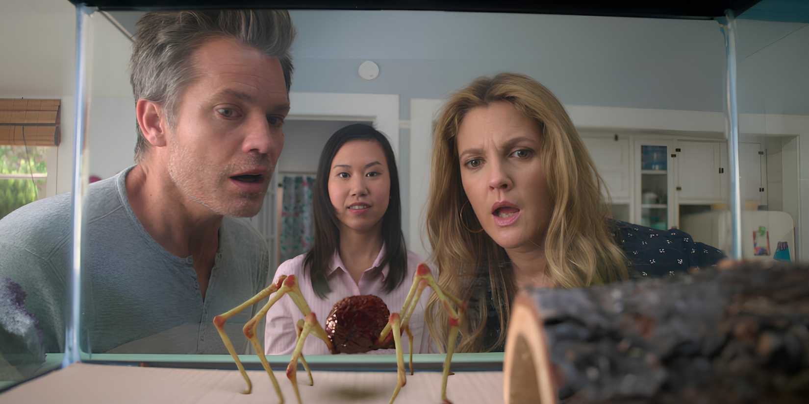 Joel (Timothy Olyphant), Ramona (Ramona Young) and Sheila (Drew Barrymore) look at Mr. Ball Legs, who is in a tank, in Santa Clarita Diet.
