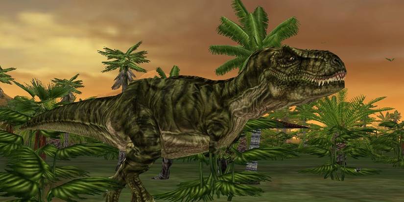 A Tyrannosaurus Rex stands among palm trees under a sunset sky in a screenshot from the 2003 video game Jurassic Park: Operation Genesis