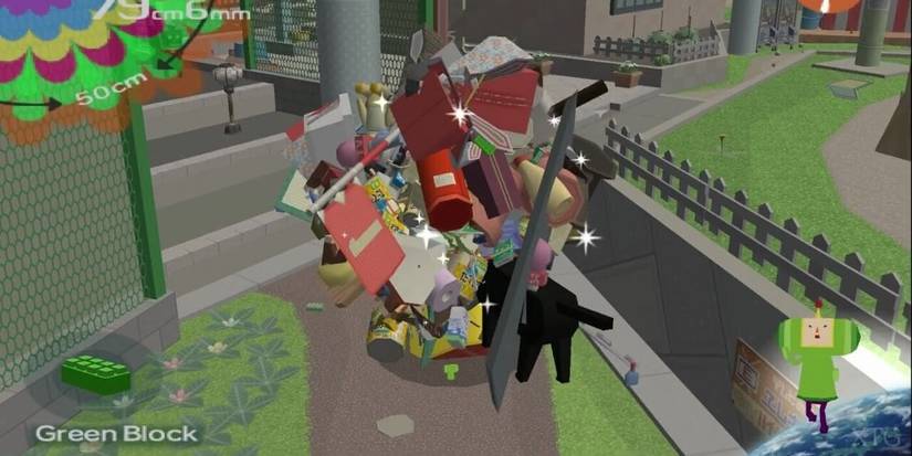 The Prince of all Cosmos rolling a giant ball of various objects around in 'Katamari Damacy' 