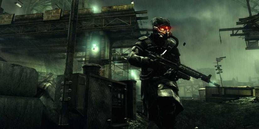 A soldier wearing a gas mask patroling an area in 'Killzone 2' (2009)