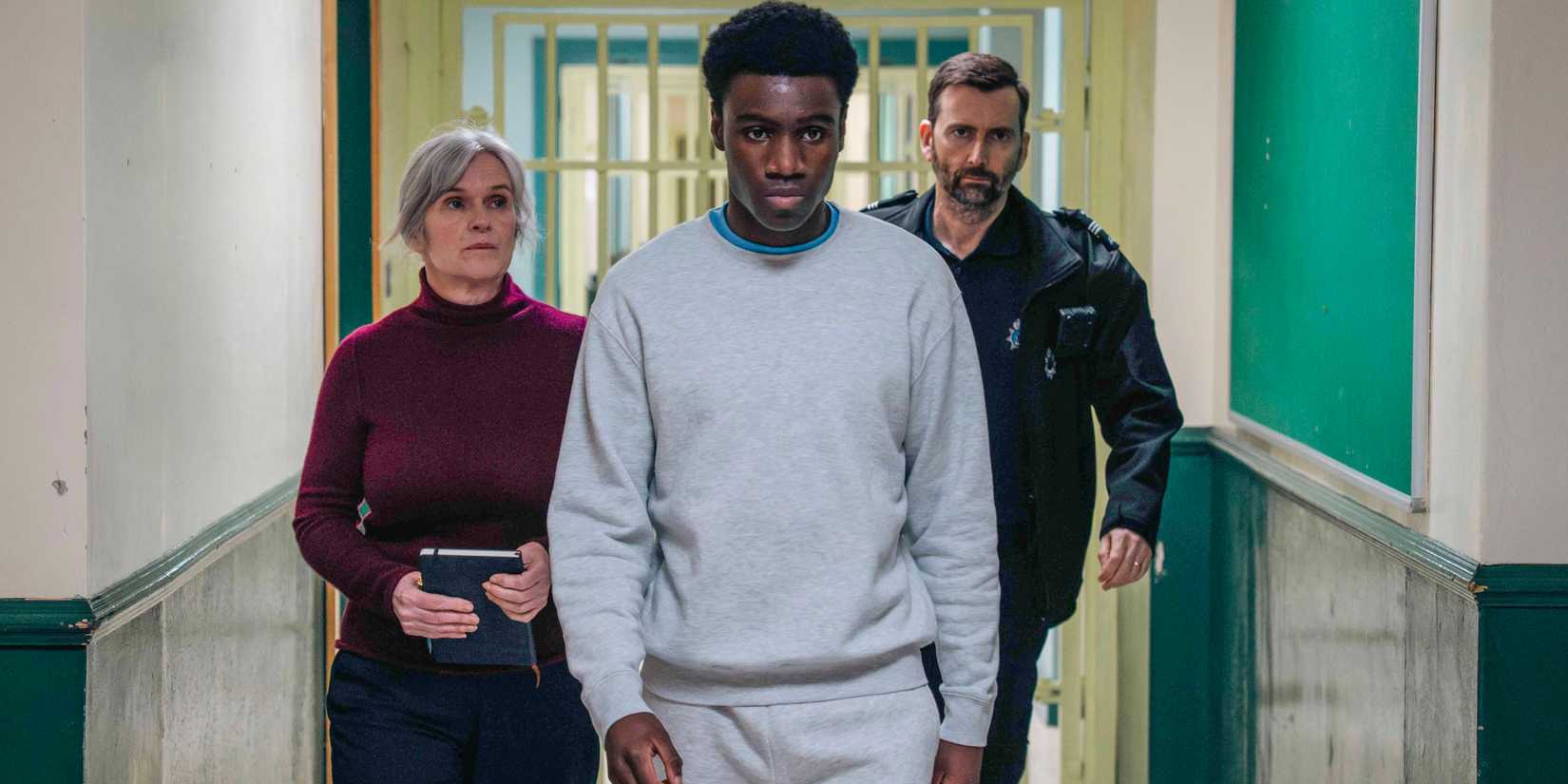 Siobhan Finneran as Prison Chaplain Marie-Louise O'Dell, Chukwubuikem Molokwu as Peter, and David Tennant as Custodial Manager Bobby Bailey in Time Season 3.