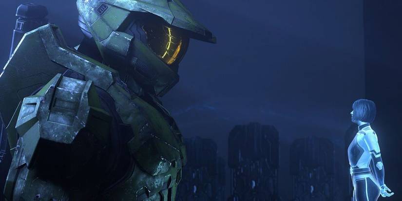 Master Chief looking at his hologram companion Cortana in 'Halo Infinite'