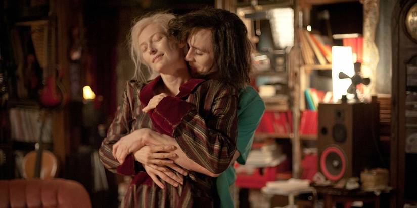 Tom Hiddleston as Adam stands behind Tilda Swinton as Eve as they embrace in Only Lovers Left Alive