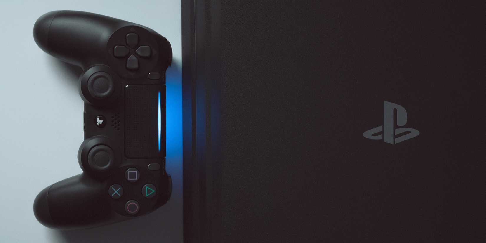 Controller next to PlayStation 4