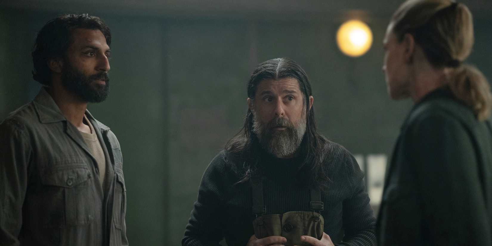 Avi Nash as Lukas Kyle, Rick Gomez as Patrick Kennedy, and Rebecca Ferguson as Juliette Nichols in Silo Season 3.