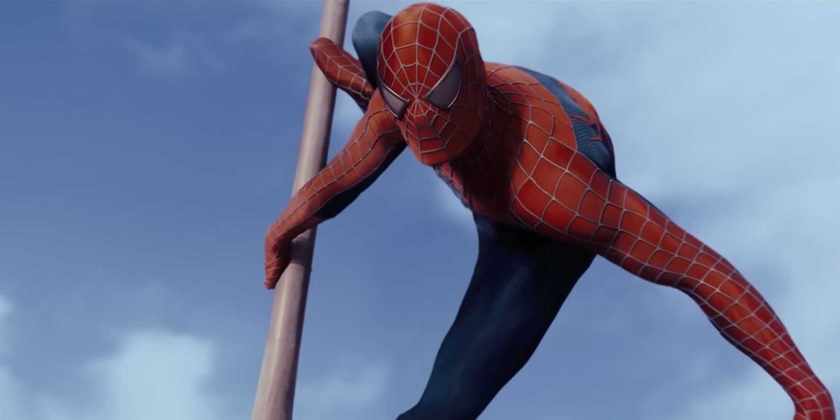 Spider-Man holding onto a flag pole in front of a blue sky in Spider-Man 2