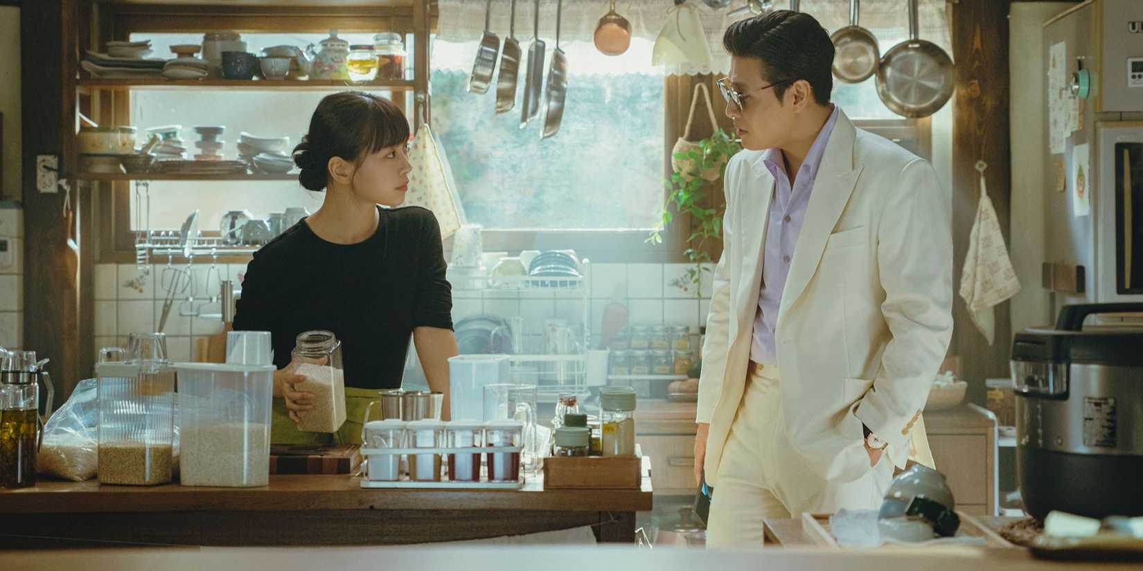 Two characters looking at each other in 'Tastefully Yours'