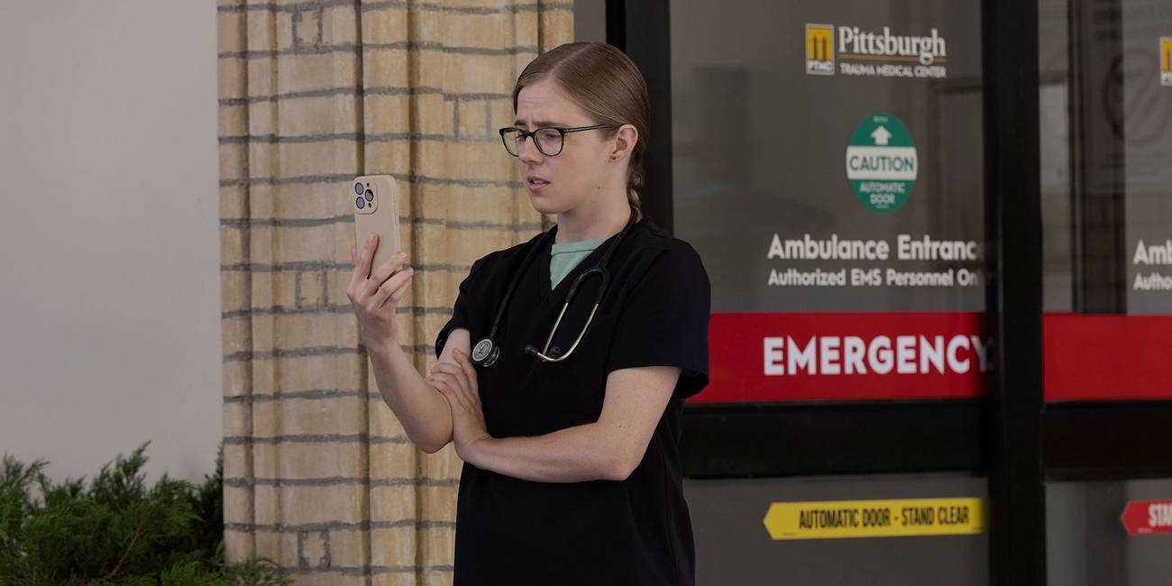 Dr. Mel King (Taylor Dearden) on her phone in 'The Pitt' Season 2.