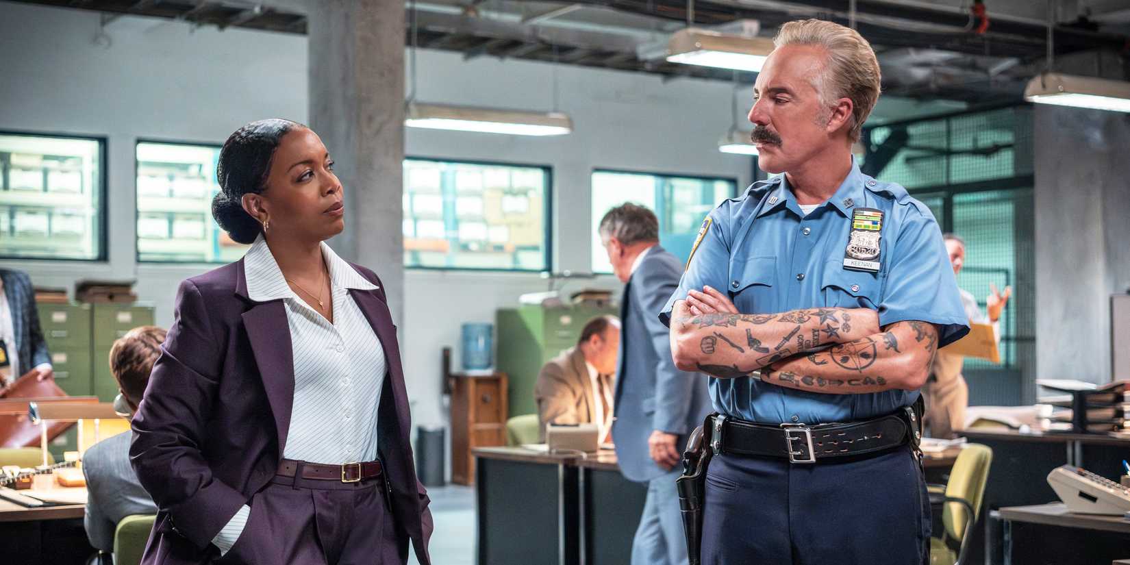 Jessica Frances Dukes as FBI Agent Polk standing with Titus Welliver as Officer Keenan in The Westies