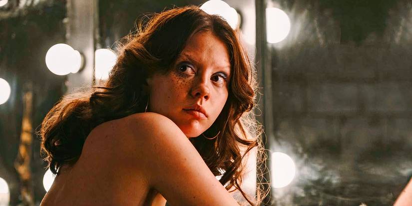 Mia Goth as Maxine Minx in ‘X’ (2022), getting ready at a mirror before the shoot 