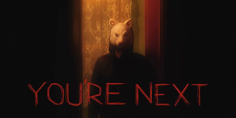 Theatrical poster for You're Next (2013) featuring Fox, one of the masked killers.