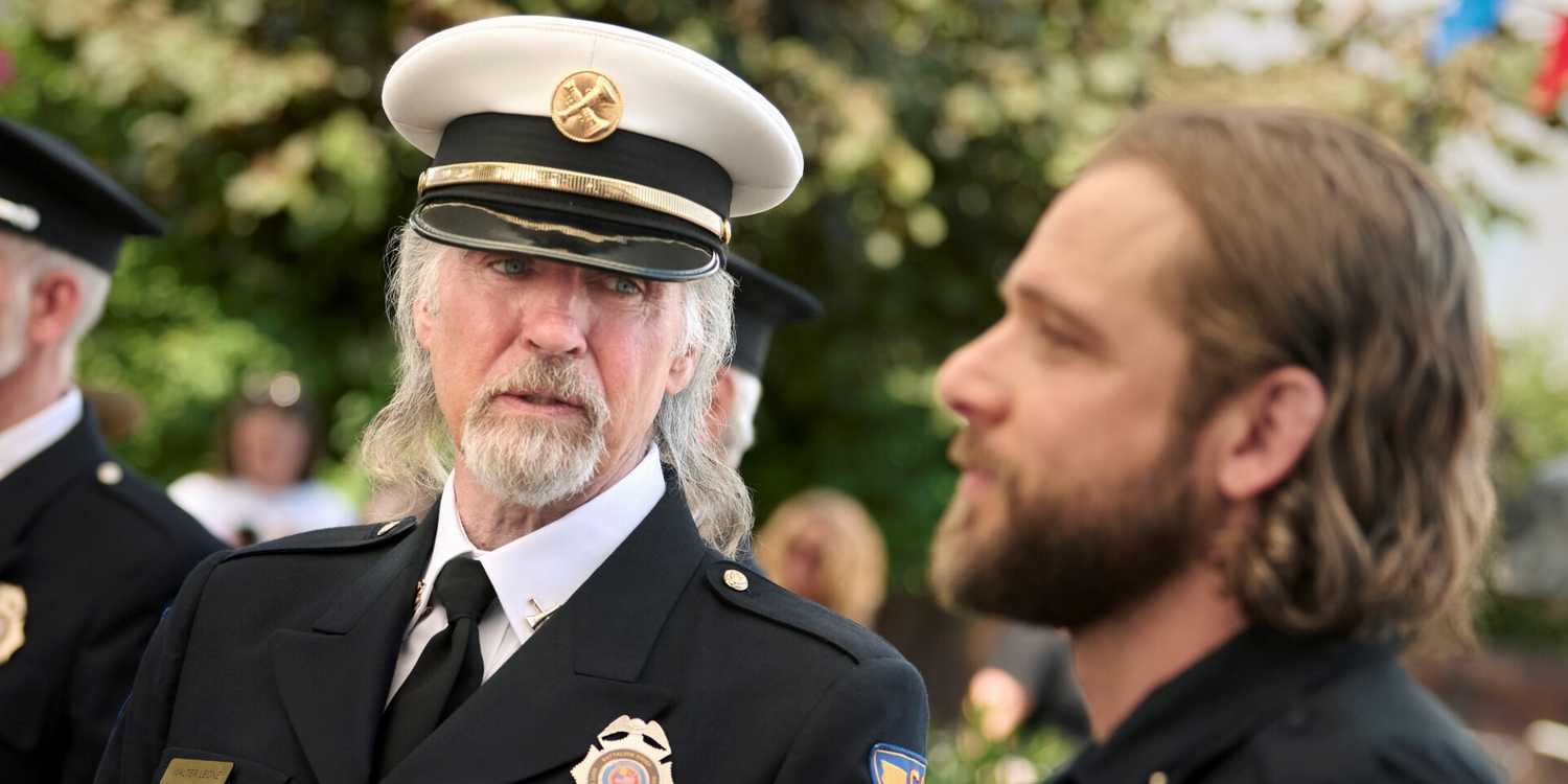 Jeff Fahey as Walter Leone looking at a blurry Max Thieriot as Bode Leone in their uniforms in Fire Country