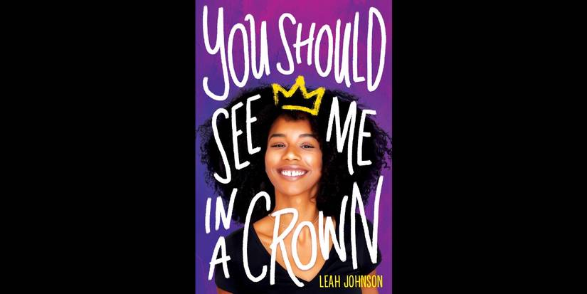 The book cover for You Should See Me in a Crown by Leah Johnson over a black background