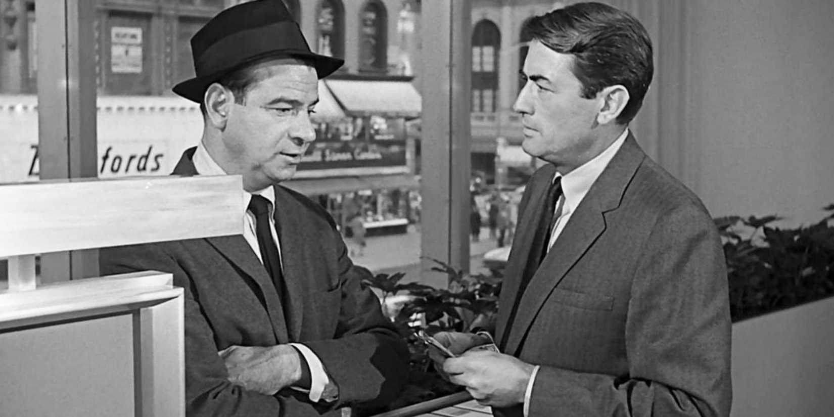 Gregory Peck looking at Walter Matthau who is standing in front of him in Mirage (1965)