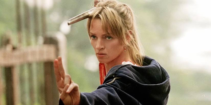 Uma Thurman as the Bride / Beatrix Kiddo posing with a samurai sword in Kill Bill: Volume 2 (2004)