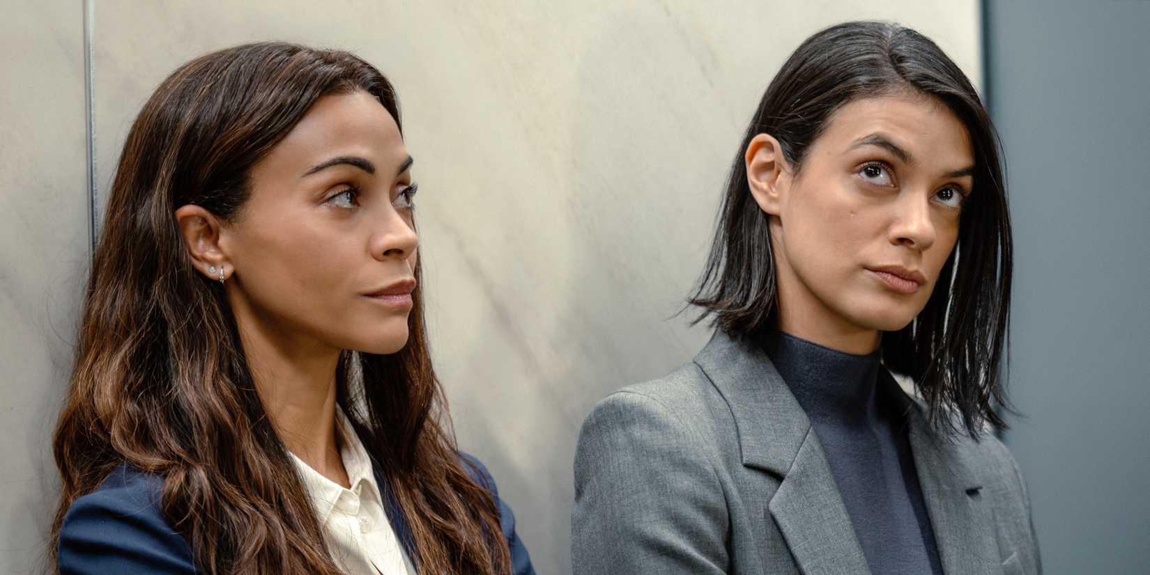 Zoe Saldaña as Joe standing next to Laysla De Oliveira as Cruz in Lioness Season 3
