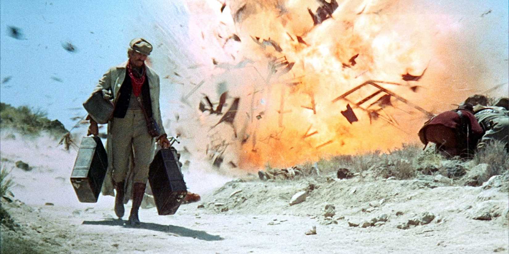James Coburn as John (Seán) H. Mallory walking away from an explosion in Once Upon a Time... the Revolution or Duck, You Sucker! (1971)