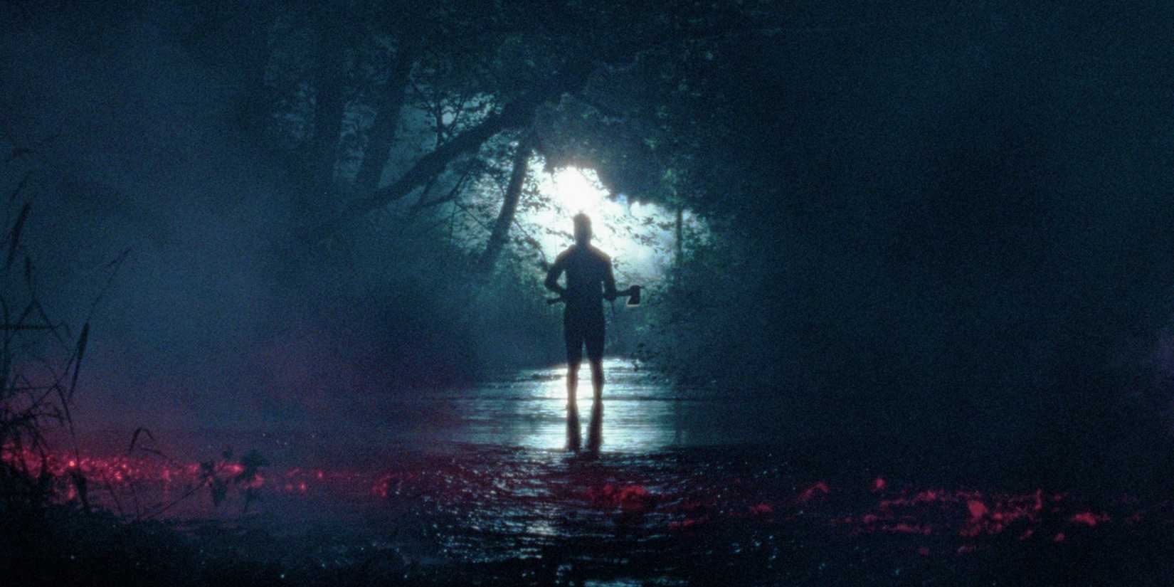 A person wielding an axe in a surreal, watery, overgrown backdrop in Pathetic Fallacy
