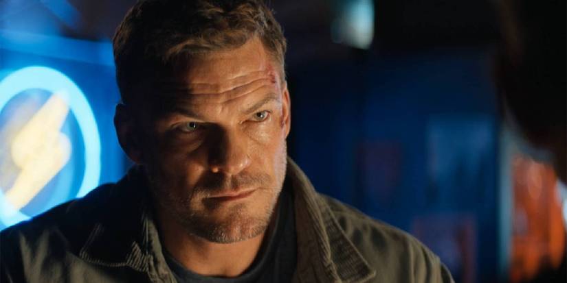 Reacher staring at someone in a bar.