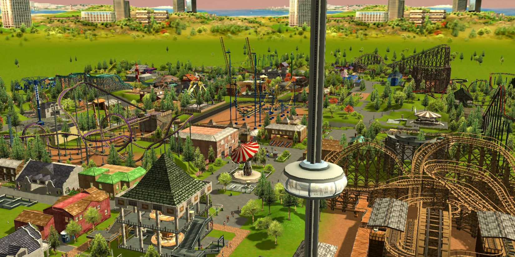 A sprawling amusement park in 'RollerCoaster Tycoon 3'