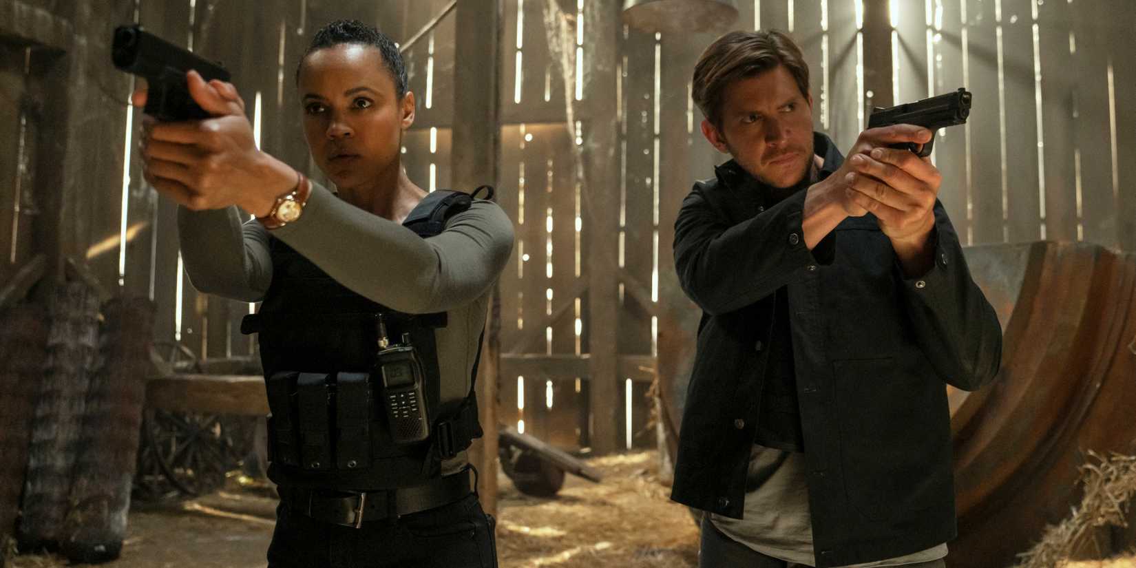 Maria Sten as Frances Neagley standing guns drawn next to Greyston Holt as Hudson Riley in Neagley